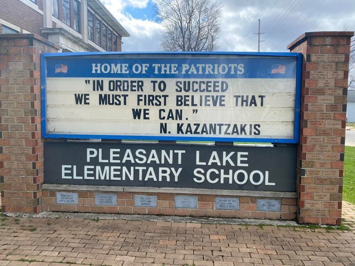 Pleasant Lake Sign with the quote "In order to succeed, we must first believe that we can."