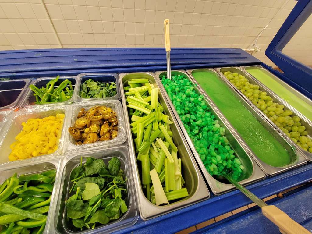 A school salad bar full of green foods