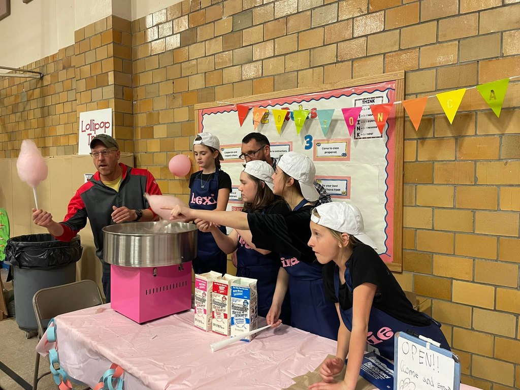 Students and Parent Volunteers making cotton candy