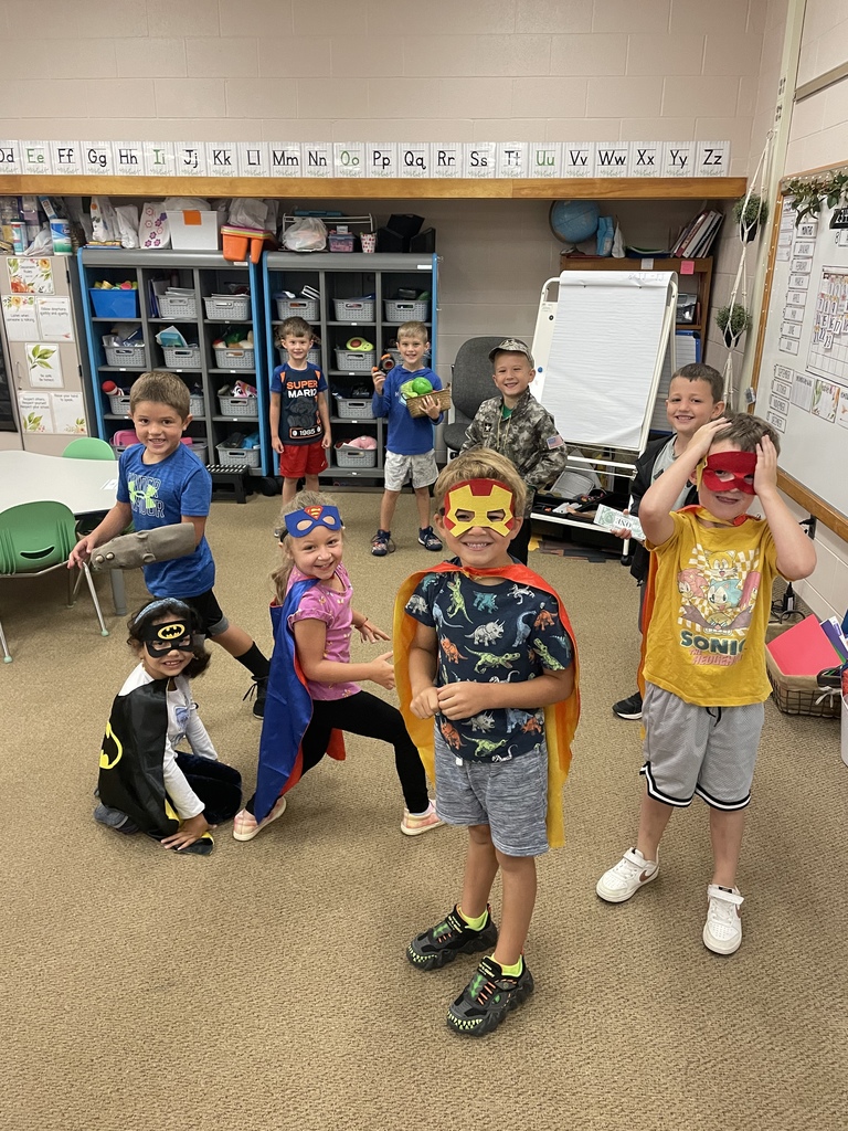 Kids in a classroom wearing costumes