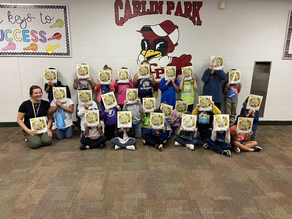 Mrs. Fulton's class posing with their first sponsored Scholastic book! HUGE thank you to Mr. Gourley!