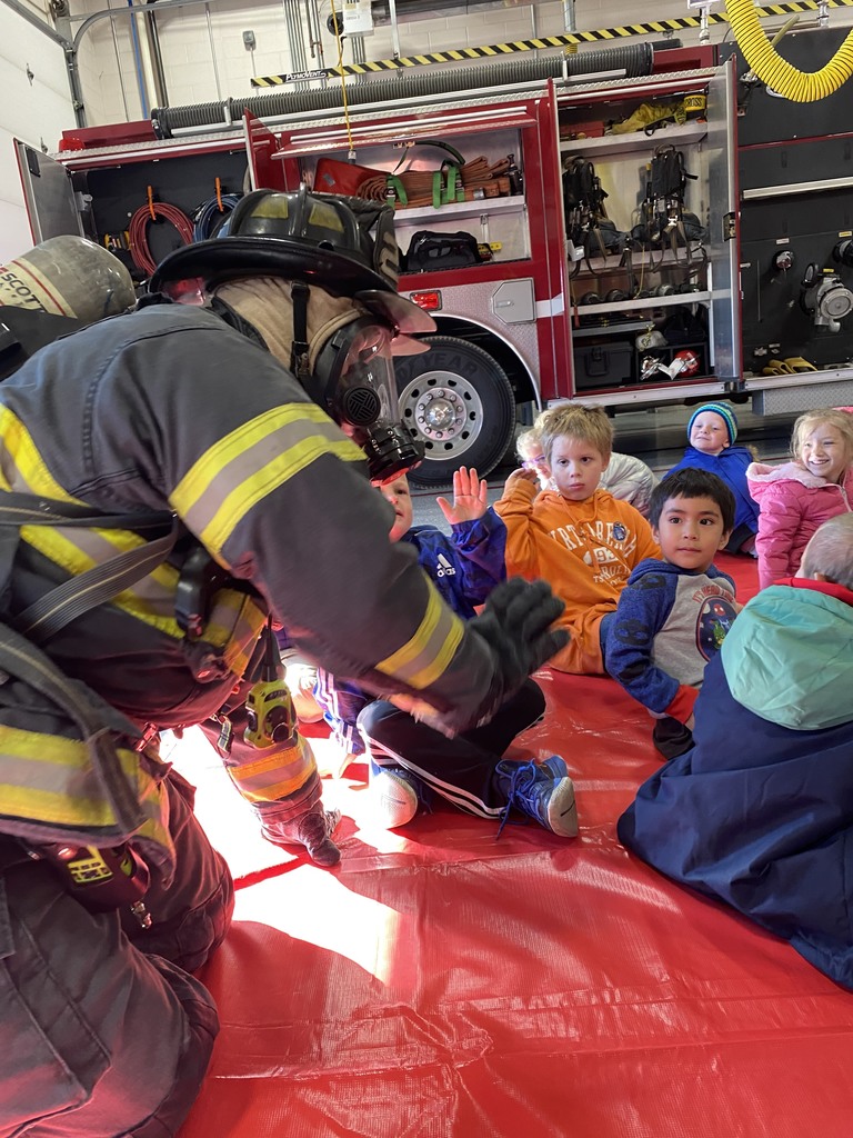 Fireman teaaching children fire safety