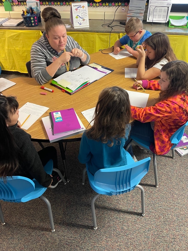 students at the back table working on fluency and deciding