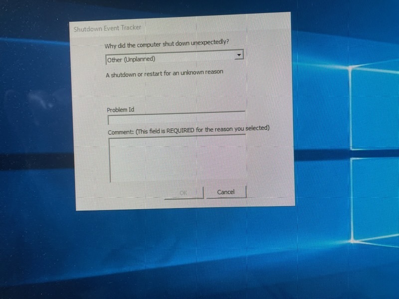 Gray pop up box in front of a standard blue Windows screen 